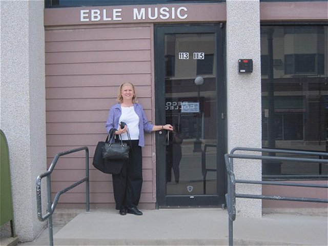 Kathy in front of Eble Music, in Iowa City, IA, a requisite visit if nearby!