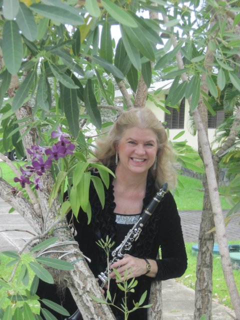 Kathy in her neighborhood, Urbanización Torrimar, where orchids grow on trees, and in June the trees put on a fabulous show of red, yellow, purple and pink blossoms. Puerto Rico has to be one of the most beautiful places on this green earth!